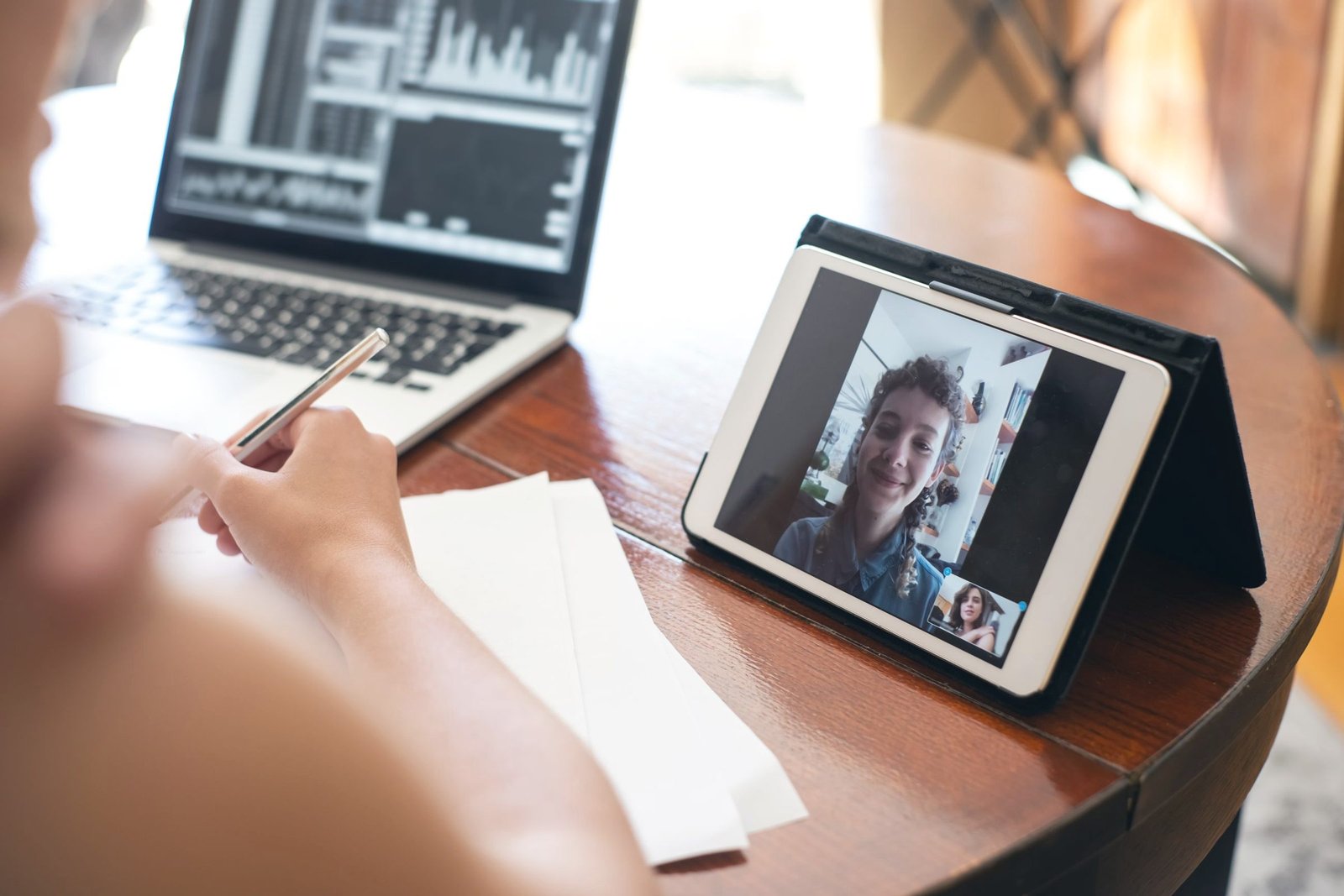 Laptop and tablet showing search and video results