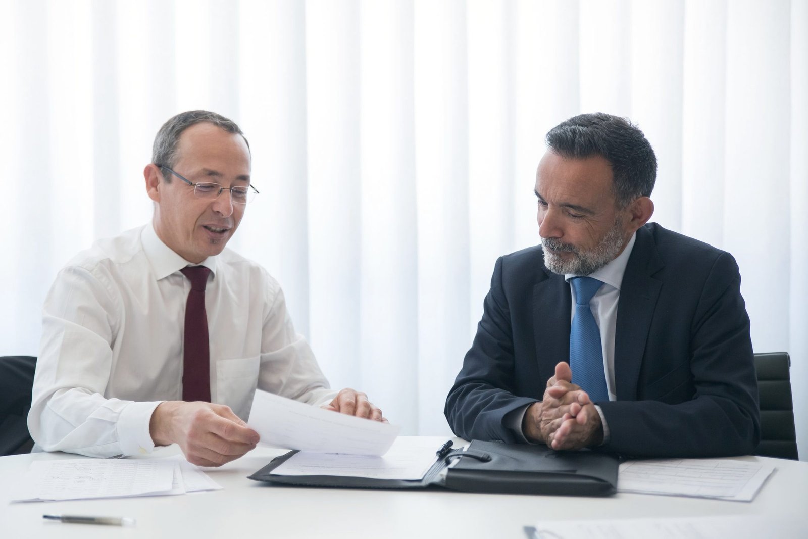 Finance professionals reviewing documents