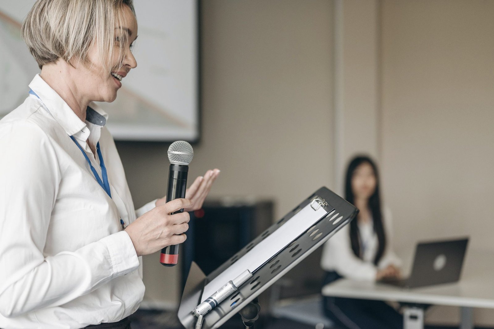 Speaker presenting with a microphone