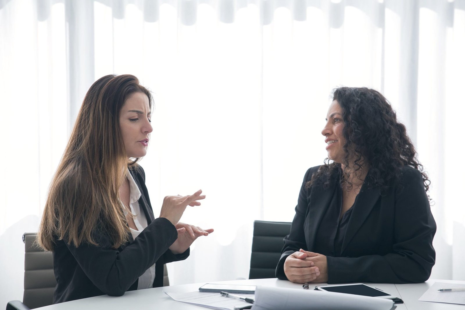 Coach in a one-to-one conversation with an executive