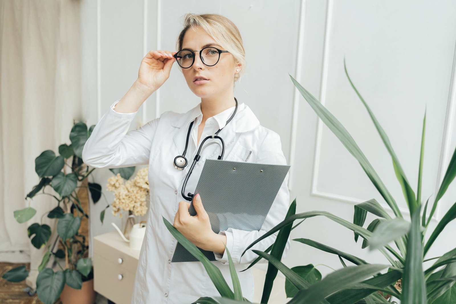 Doctor reviewing notes in a bright clinic