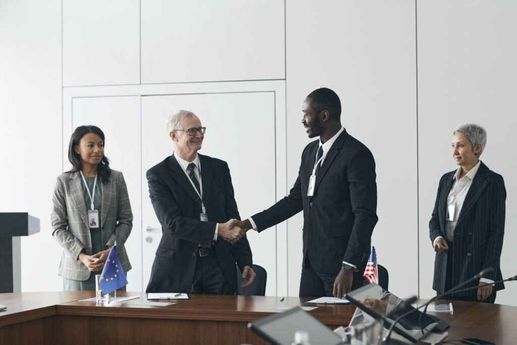 Delegates shaking hands at a conference