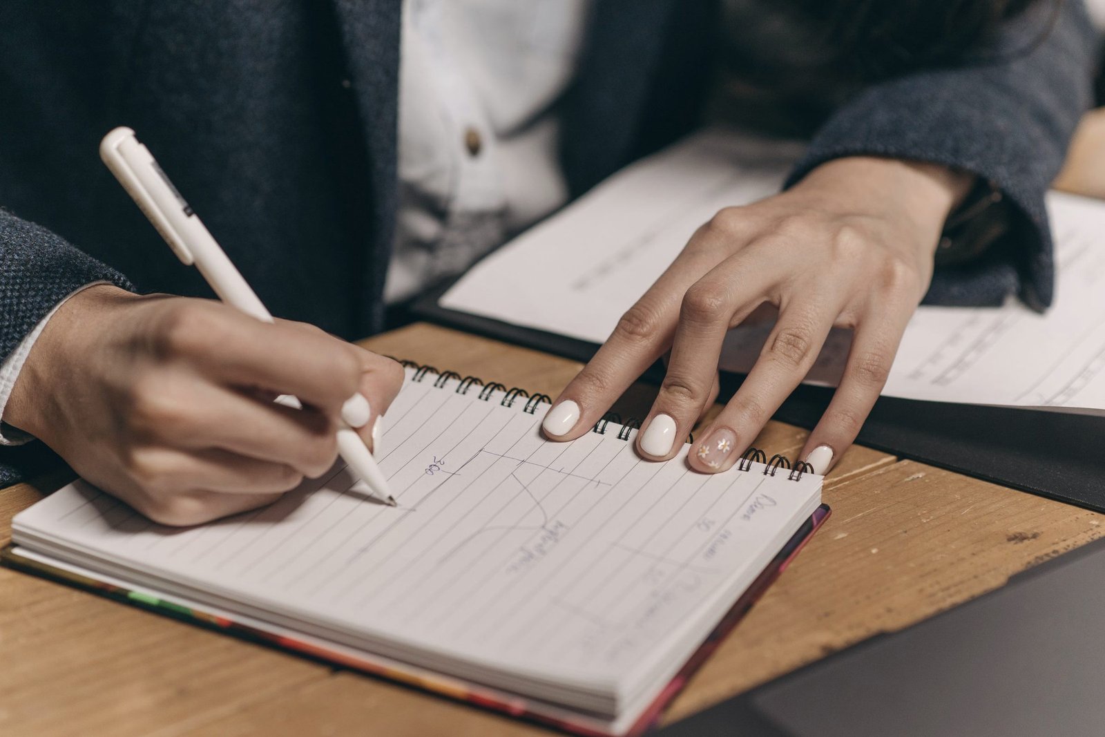 Reviewer making notes by hand